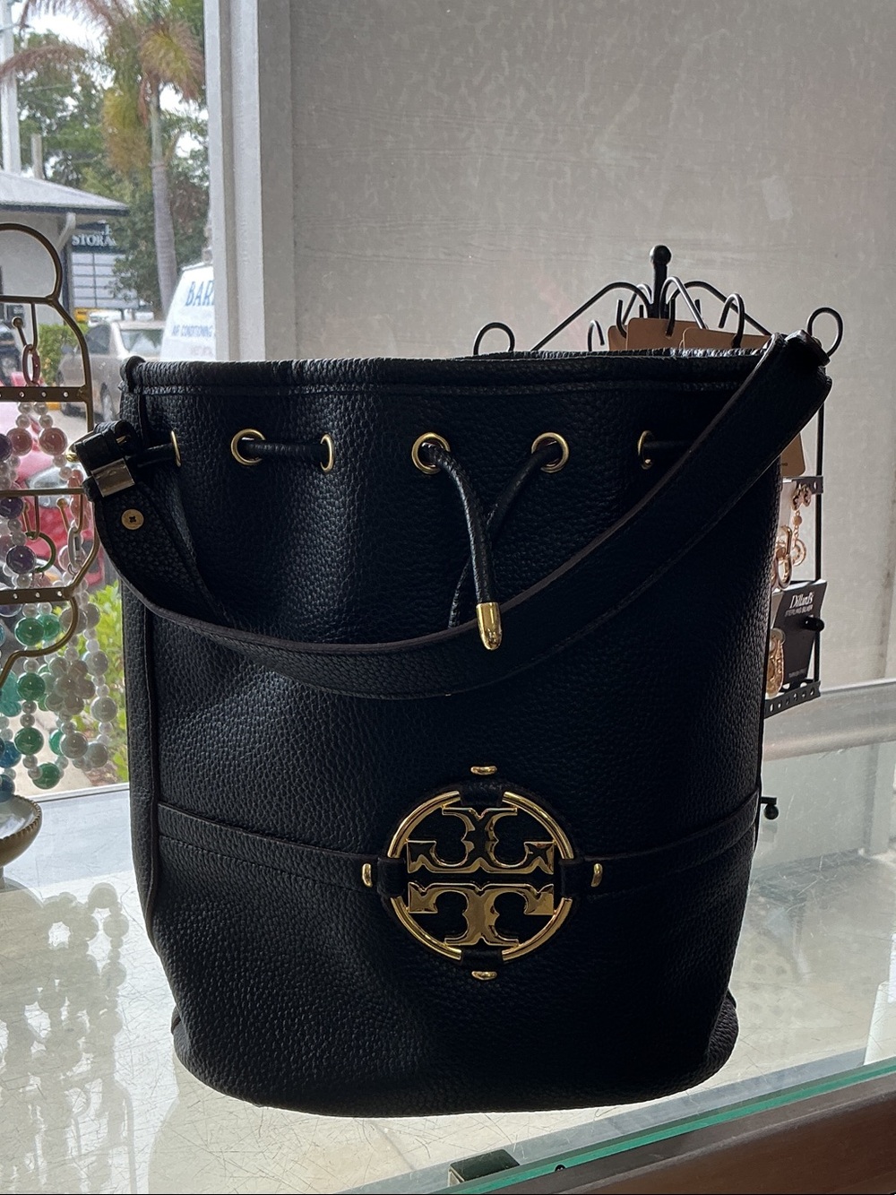 Black Leather Drawstring Bucket Bag with Gold Accent